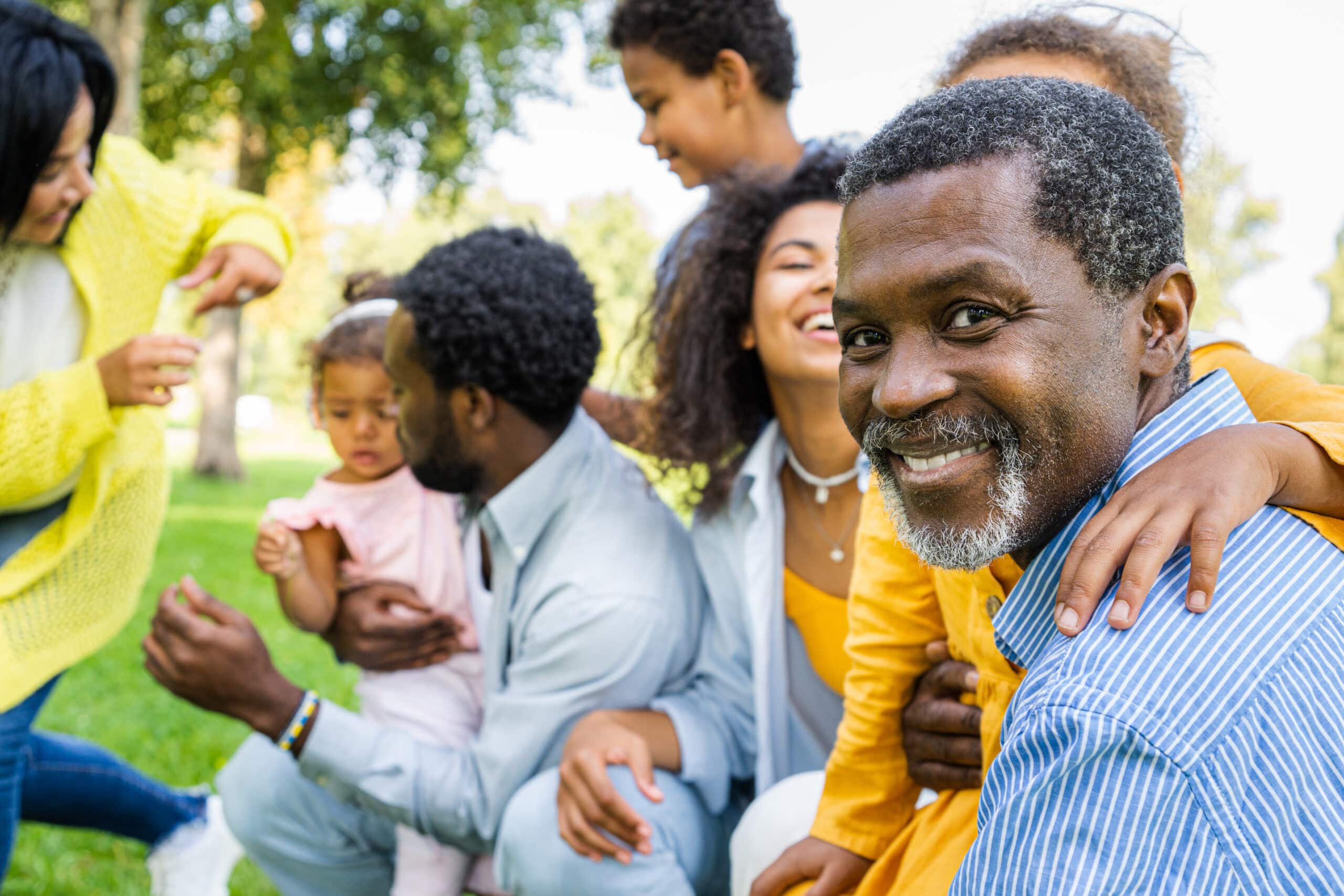 Beautiful happy african american family bonding at the park