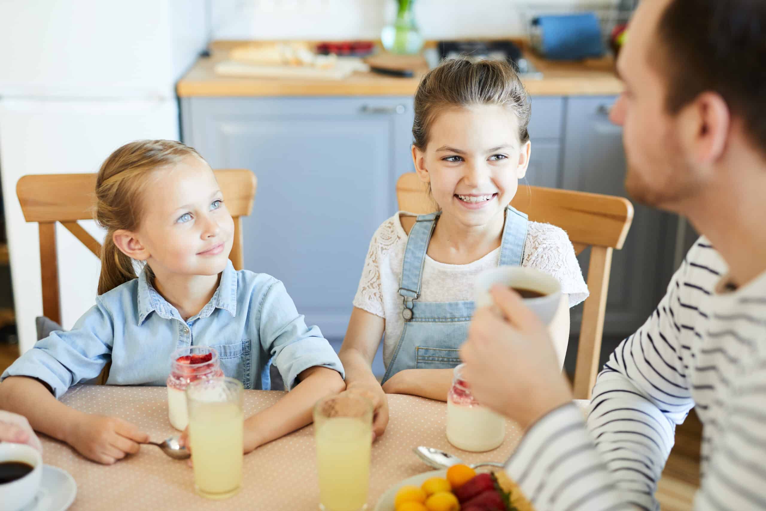 Girls talking to father